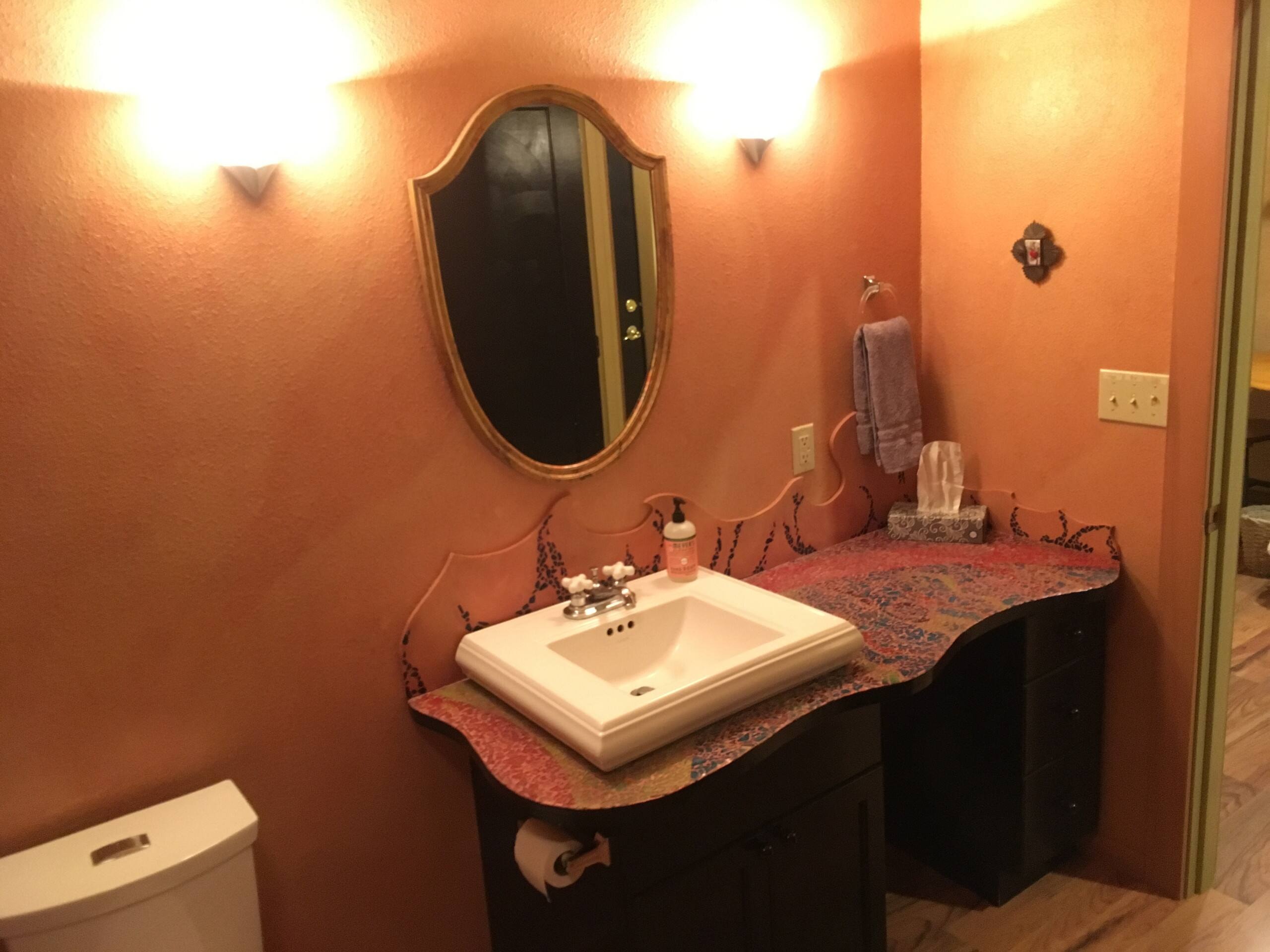 Bathroom vanity with hand-painted mosaic countertop