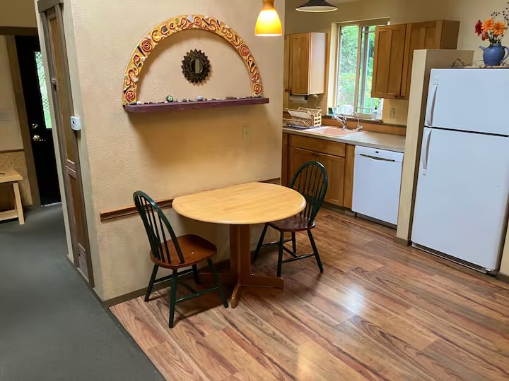 Kitchen dining area with hand-painted mosaic arch
